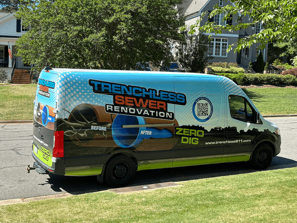 Branded service van with equipment at a residential job site